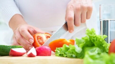 Vegetable is cut with a knife